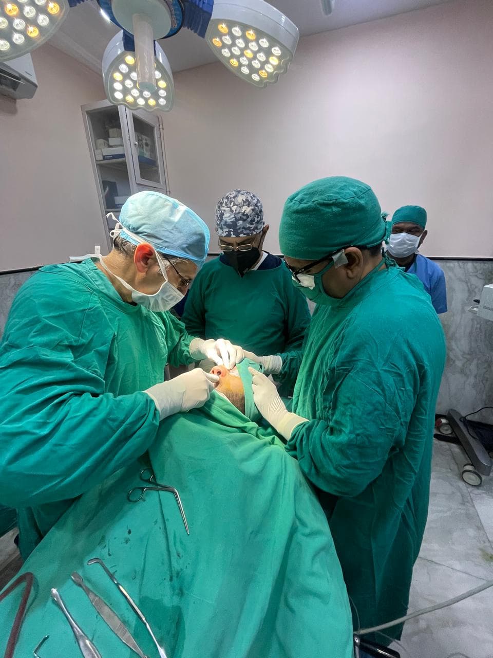 Surgeons performing a DCR tear duct procedure